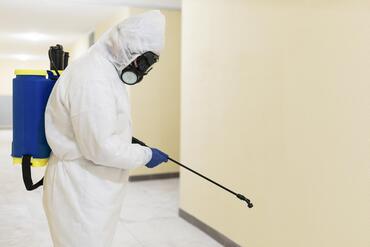cleaning-man-disinfecting